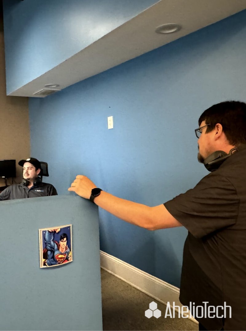 IT Helpdesk team providing support for diverse technology needs in a modern office environment.